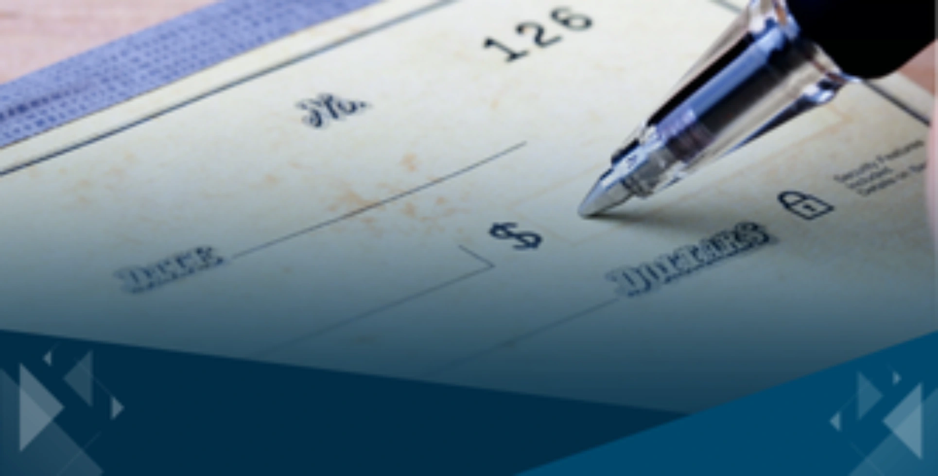 Pen filling out a check used to illustrate tax-efficient gift planning